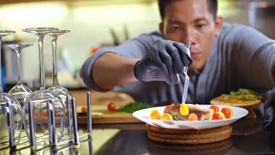 Virtual Chef contenstant plating a gourmet dish.